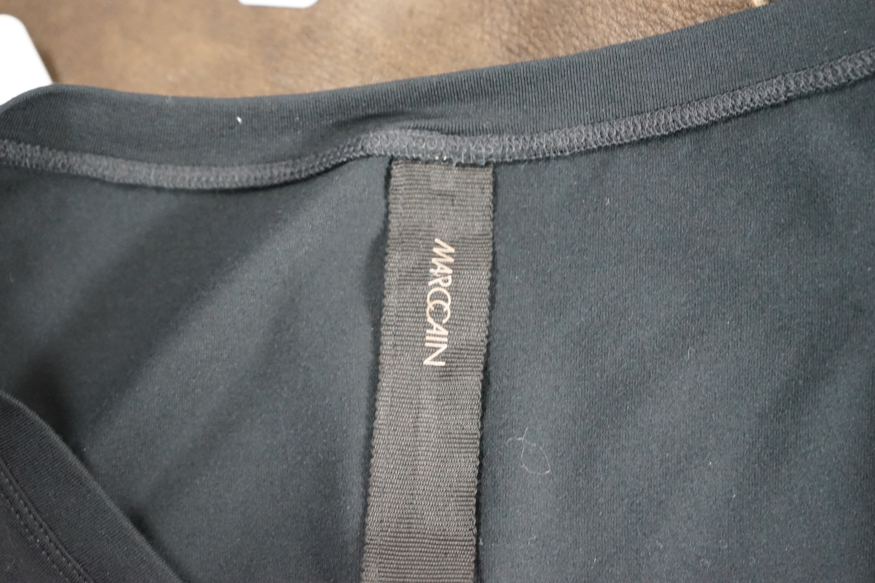 A Marc Caine lady's faux suede coat and three tops. Approx sizes 14-16 Proceeds to Happy Paws Puppy Rescue